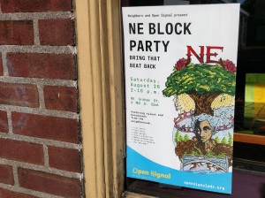 Poster in window for Open Signal block party